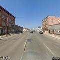 Officer checks woman on bicycle on Blaine Avenue