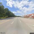 Car stopped in lane unloading wheelchair