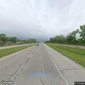 Disabled car with white smoke on Highway 51