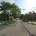 Elderly man in wheelchair riding in middle of street