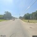 Rail workers inspecting grade crossings on main line