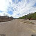 Truck driving on Highway 64 with possible flat tire