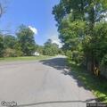 Car hits tree; driver reports back pain