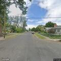 Suspicious occupied sedan reported on Maple Street