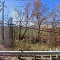 Large unattended yard fire along State Route 125