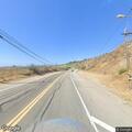 Vehicle fire spreading on Malibu Canyon Road