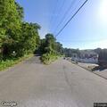 Large tree branch blocking part of roadway