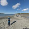 People blocking vehicle on Bar Island sandbar