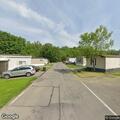 Woman experiencing severe knee pain on Oakwood Ln