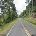 Welfare check for man sitting beside road in Nehalem