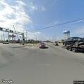 Red car causing traffic issue at highway intersection