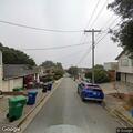Car parked in no-parking zone causing traffic hazard
