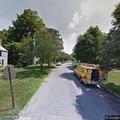 Person experiencing back pain near Allen Place