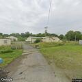 Object hanging over road from mobile home