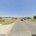 Person standing in roadway at intersection