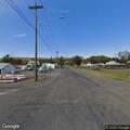 Person lying on ground with hallucinations at Dayton intersection