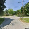 Officer with loose horse near cemetery
