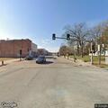 Woman holding sign in Vandalia intersection
