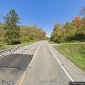 Vehicle stopped in roadway after crossing hay field