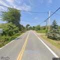 Motorcycle crash with rider down on North Road