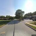 Person smoking marijuana in apartment parking lot