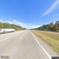 Car seen driving on highway with both doors open