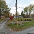Elderly woman walking in middle of roadway