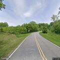 Tree blocking roadway with possible power lines