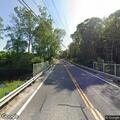 Car crashes into woods and occupants flee scene