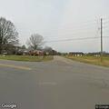 Person waving arms in roadway on West Highway 27