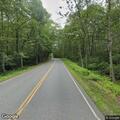 Officer reviews old crash scene near Montague