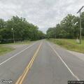 Motorcycle hits deer, driver pinned under bike