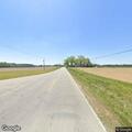 Man walking in roadway on Wilsons Mills Road