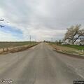 Rollover crash damages stop sign at county road