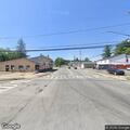 Person walking in roadway near Route 13 and Utica St