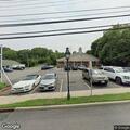 Disabled car with open door in parking lot