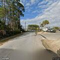 Man questions vehicle with dog at Panama City Beach