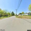 Truck pulls down house wires and leaves scene