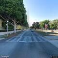 Older man walking in traffic near La Peer and Burton