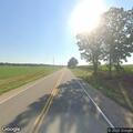 Disabled farm truck blocking County Road J