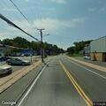 Disabled vehicle with gas leak on Main Street