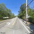Parked car causing traffic hazard at stop sign