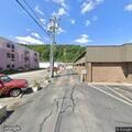 Male experiencing chest pain at West Hamlin Plaza