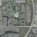 Unattended gray sedan in driveway at Grand Palm