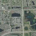 Grass fire burns side of Coconut Creek home