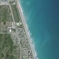 Fishermen casting lines near swimmers at Juno Pier