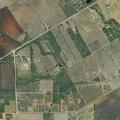 Grass fire spreading near buildings in Jourdanton