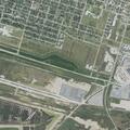 Semi-truck hit in dirt lot near port entrance