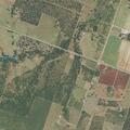 Grass fire spreads to property near Highway 173