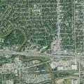 Person experiencing abdominal pain at Houston intersection